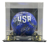 Sports Integrity 1999 USA Soccer Women's Team Signed Blue Nike Ball, featuring white "USA" lettering and multiple silver signatures, displayed in a clear acrylic case with black base and gold accents.