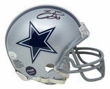 The Sports Integrity Emmitt Smith Signed Dallas Cowboys Mini Replica Helmet (JSA) features a silver finish, blue star logo, dark signature, gray facemask, authenticity stickers, and is a must-have for any memorabilia collection.