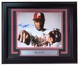 A Sports Integrity 50 Cent Signed Framed 8x10 Photo (BAS); features 50 Cent in a red cap and white shirt, pointing at the camera, with a nameplate reading “50 CENT” underneath.