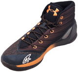 A black and orange Stephen Curry Golden State Warriors Signed Under Armour Curry 3 high-top shoe by Sports Integrity, featuring speckled details, black and orange laces, and a white signature on the toe.