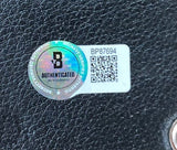 The Dustin Poirier Signed Full Size MMA Replica Championship Belt by Sports Integrity features a Beckett sticker (code BP87694), QR code, and holographic seal reading "Beckett Verified Authentic Autograph" on a textured black surface.