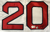 The Kevin Youkilis Boston Signed White Baseball Jersey by Sports Integrity features a red and black outlined number 20 sewn on white fabric, two authentication stickers, and a signature on the bottom right of the zero.