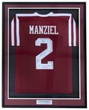 The Sports Integrity Johnny Manziel Signed Framed Maroon College Football Jersey features white sleeve stripes, "MANZIEL" and #2 on the back, plus a signature and three inscriptions displayed below the number inside the frame.