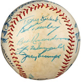 A 1958 New York Yankees Spalding baseball by Sports Integrity, covered with autographs including Berra and Ford. PSA LOA authenticated; red stitching and multiple blue ink signatures cover much of the ball’s surface.