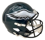 The Sports Integrity Saquon Barkley Signed Philadelphia Eagles Full Size Replica Speed Helmet BAS ITP is dark green with a white eagle wing logo, black facemask, and features Barkley's silver autograph on top.