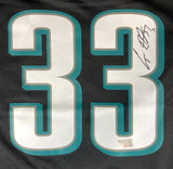 A Cooper DeJean Signed Philadelphia Eagles Nike Game Jersey by Sports Integrity featuring the number 33 in white with teal outline and his autograph in black ink on the upper part of the second 3.