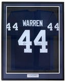 Sports Integrity's Tyler Warren Penn State Signed Framed Blue Football Jersey, featuring "We Are" and JSA authentication, showcases Warren’s autograph on the left 4 and a plaque below with his name and team.