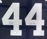 The Sports Integrity Tyler Warren Penn State Signed Framed Blue Football Jersey features two large white number 4s on a dark background—one side signed by Warren, the other with “We Are…” handwritten above. JSA authenticated.