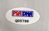 A white oval PSA/DNA sticker with code Q05798 is on the Sports Integrity Tiger Woods Signed Framed 2007 PGA Championship Flag, shown against a textured gray surface.