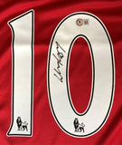 Close-up of a red Wayne Rooney Manchester Signed 2007 Nike Soccer Jersey by Sports Integrity featuring the number 10 in white/black with Premier League lion logos, Rooney’s signature on the 0, and a BAS authentication sticker atop the digit.