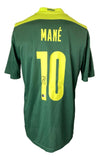 The Sadio Mane Signed Senegal Puma Soccer Jersey by Sports Integrity features MANÉ and number 10 on the back with his signature beneath, in green with yellow accents.