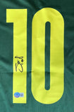 The image displays a green Sadio Mane Signed Senegal Puma Soccer Jersey by Sports Integrity, featuring a large yellow number 10 with a signature on its left and a small blue authenticity sticker below.