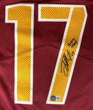 The Sports Integrity Terry McLaurin Signed Commanders Nike Limited Jersey "Scary Terry" BAS features a maroon design with a large yellow number 17, black polka dots, an autograph on the 7, and an authentication sticker near the bottom.