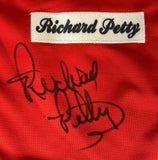 The Sports Integrity Richard Petty Signed Red Racing Jacket features a white name patch with “Richard Petty” in black script and a large black autograph below, authenticated by JSA Hologram.