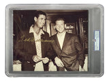 Two men, Ted Williams and Mickey Mantle, stand smiling indoors for a black-and-white photo. Ted holds an item with his signature visible. This PSA Mint 9 Sports Integrity 8x10 Red Sox photo is slabbed and authenticated.