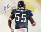 The image shows a football player in a green Eagles jersey with "GRAHAM" and 55 running forward, featuring Brandon Graham's blue autograph. Product: Brandon Graham Signed 16x20 Philadelphia Eagles Photo (Sports Integrity).