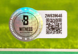 A holographic Beckett Witness Authentication sticker with a QR code and serial number 2W539645 is affixed to the Saquon Barkley Signed Framed 16x20 Eagles Kelly Green Photo by Sports Integrity.