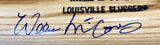 Close-up of a Sports Integrity Willie McCovey Giants Signed Louisville Slugger Baseball Bat, showing a blue ink autograph across the wood grain and engraved brand details above the signature.
