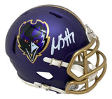 The Sports Integrity Rashod Bateman Signed Baltimore Ravens Alternate Mini Speed Helmet BAS features a purple helmet with gold faceguard, team logo, and white autograph on the side.