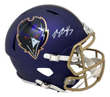 A Rashod Bateman signed Ravens full size alternate speed replica helmet by Sports Integrity, featuring a purple shell, gold faceguard, team raven logo, and white autograph on the side.