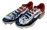 Adley Rutschman 2024 Game Used Baltimore Orioles Nike Cleats by Sports Integrity feature a red, white, and blue American flag design with gold swooshes, red interiors, and white laces.