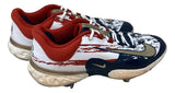 A pair of Adley Rutschman 2024 Game Used Baltimore Orioles Nike Cleats by Sports Integrity featuring a white base, red accents, gold swooshes, blue and red streak designs, red interiors, white laces, and metal cleats.