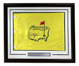 The Sports Integrity Phil Mickelson Signed Framed Undated Masters Golf Flag features a yellow flag with a red pin, green U.S. outline, black marker signature, PSA hologram, and plaque reading “Phil Mickelson 3-Time Champion.”.