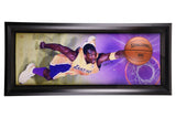 The Sports Integrity Kobe Bryant Signed Framed 24x54 Lakers Breaking Through Collage features Kobe in a yellow Lakers uniform, mid-air with a basketball, against a purple and gold background. "Kobe Bryant" is written on the left side.