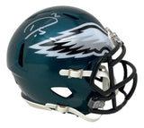 The Darius Slay Signed Philadelphia Eagles Mini Speed Helmet by Sports Integrity features a dark green finish, a silver and white eagle wing logo on the side, and Darius Slay's white signature on top.