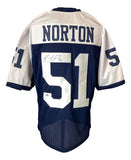 A Ken Norton Jr Dallas alternate blue football jersey by Sports Integrity, autographed with number 51 on the back and sleeves, features NORTON’s name and a signature on the left side of the number.