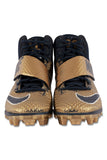 The Aaron Donald 2016 Los Angeles Rams Game Used Nike Football Cleats by Sports Integrity feature gold and black textured uppers, lace-up fronts, and Velcro straps, displayed from the front on a white background.