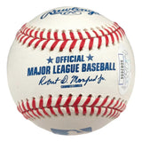 A close-up of a Sports Integrity Adley Rutschman Baltimore Orioles Signed Rawlings Official MLB Baseball, featuring red stitching, blue text, the commissioner's signature, and a JSA SD serial number sticker.