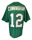 A Randall Cunningham Philadelphia Kelly Green football jersey by Sports Integrity, featuring his name and number 12 in white on the back, autographed and authenticated by BAS.