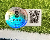 A Beckett Witness Autograph authentication sticker with a holographic B logo, QR code, and serial number 2W738799 is featured on the Sports Integrity AJ Brown Signed 16x20 Philadelphia Eagles Super Bowl 59 Photo BAS.