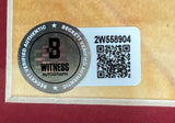 A Beckett Witness Autograph sticker with a circular holographic B seal and QR code 2W558904 is affixed to the tan/red border of a Sports Integrity Allen Iverson Signed Framed 16x20 76ers Photo vs Michael Jordan BAS.