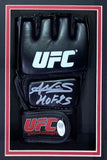 A black Amanda Nunes Signed UFC Glove (HOF 25), with white UFC logos and silver autograph, comes in a Sports Integrity shadowbox display with authentication sticker and an 8x10 Rousey photo. Includes JSA QR.