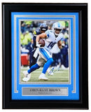 The Sports Integrity Amon-Ra St. Brown Signed Framed 8x10 Detroit Lions vs Seattle Photo features #14 in action and includes an autograph, displayed with a name plaque in a quality frame. Authenticated by JSA.
