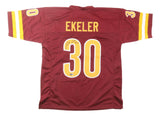 The Sports Integrity Austin Ekeler Washington Signed Burgundy Football Jersey features yellow and white details, Ekeler’s name and number 30 on the back, with the number 30 autographed.