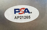 A metallic oval white PSA sticker with blue and red letters appears above code AP21265 on the Baker Mayfield Signed Framed 8x10 Tampa Bay Buccaneers Photo by Sports Integrity.
