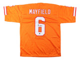 The Sports Integrity Baker Mayfield Tampa Bay Signed Orange Football Jersey BAS features white and red sleeve stripes, "MAYFIELD" across the back, a large number 6 below, and a black signature on the number.