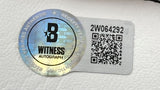 A Sports Integrity Jim Kelly Thomas Reed Signed Bills Logo Football Bills Dynasty BAS w/ Case features a Beckett Witness Autograph sticker with holographic seal, QR code, and serial number 2W064292 on a white textured surface.