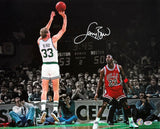 This Sports Integrity Larry Bird Signed 16x20 Boston Celtics Photo features Bird in jersey #33 shooting over Jordan (#23, Bulls), with Boston leading Chicago. Includes PSA/DNA authentication.