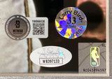 Close-up of authentication stickers on the Sports Integrity Larry Bird Magic Johnson Signed Framed 16x20 Celtics Shirt Pull Photo (JSA+BAS), including a Beckett Witness QR sticker, a “Larry Bird 33 AUTHENTICATED” hologram, and an oval sticker with code WB397133 by the NBA logo.
