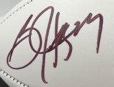 A close-up of Bo Jackson’s bold autograph on a white Oakland Raiders logo football by Sports Integrity, authenticated by BAS ITP and displayed in a case.