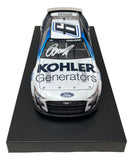 The Sports Integrity Brad Keselowski Signed 1:24 NASCAR Kohler Die-Cast Car PSA/DNA features the number 6, Kohler Generators logo, and an autograph on the hood, displayed on a black base.
