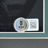A holographic Beckett Witness sticker with QR code and serial #1W471759 is on the corner of a framed Brandon Graham Signed 16x20 Eagles Photo SB LII Champs by Sports Integrity, featuring a green and white mat.