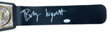 A close-up of the Bray Wyatt Signed WWE Championship Toy Belt by Sports Integrity, featuring a silver autograph and a JSA hologram authentication sticker.