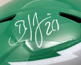 A close-up of the Sports Integrity Brian Dawkins Signed Eagles FS Kelly Green Speed Replica Helmet (with case), featuring a white autograph, number 20, black ventilation slots, and a partial white lightning bolt design.