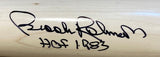 A close-up of a tan Rawlings Big Stick bat signed in black marker by Brooks Robinson with HOF 1983 written underneath, from Sports Integrity.