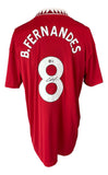 This Sports Integrity Bruno Fernandes Signed Manchester United Adidas Soccer Jersey features white letters, collar details, and red fabric. "B. Fernandes" and number 8 are on the back, with his autograph in black ink on the number.
